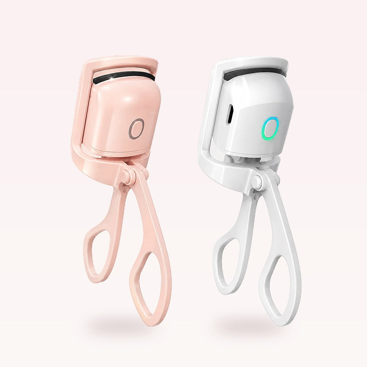 Heated eyelash curler in pink and white
